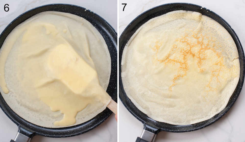 Crepe is being turned over in a black pan.