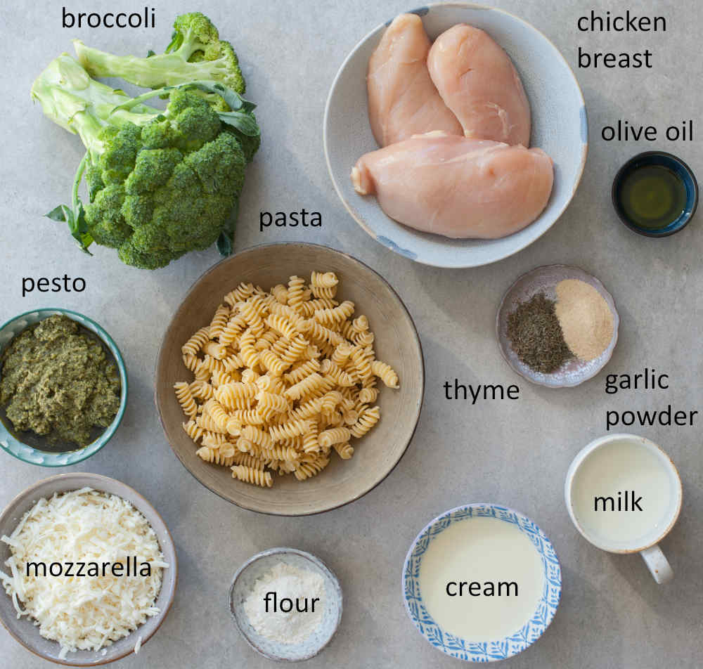 Ingredients needed to prepare pesto chicken bake with pasta and broccoli.