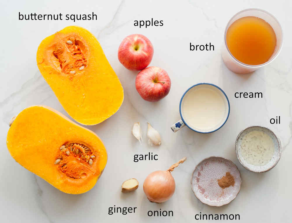 Labeled ingredients needed to prepare butternut squash apple soup.