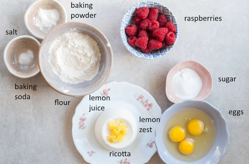 Labeled ingredients for lemon ricotta pancakes with raspberries.