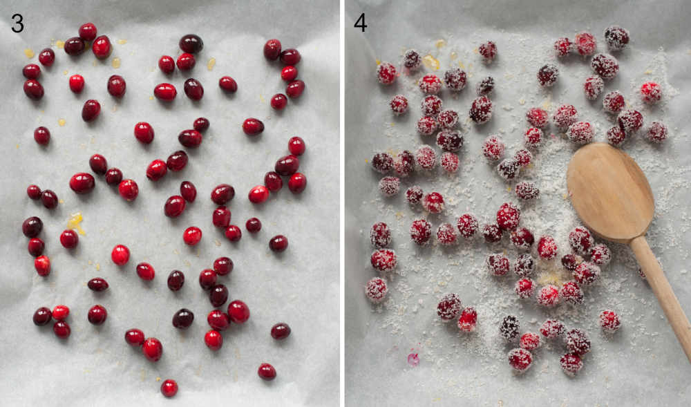 Sugared cranberries on a baking tray lined with wax paper.