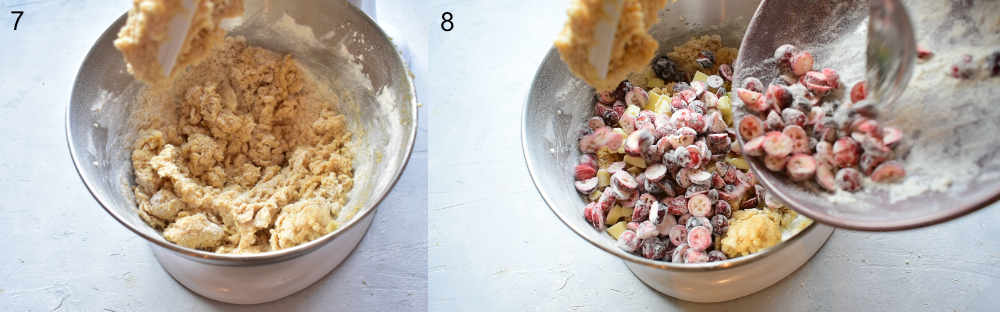 Cookie dough in a bowl. Cranberries and white chocolate are being added to the cookie dough in a bowl.