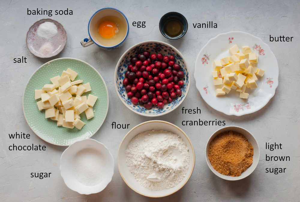 Labeled ingredients needed to prepare cranberry white chocolate cookies.