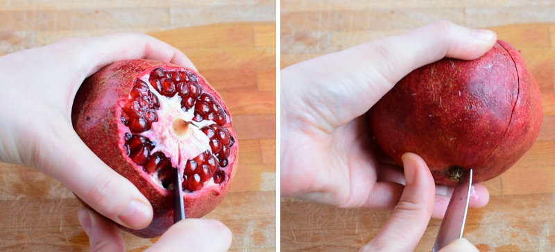 Ridges of a pomegranate are being scored with a pairing knife.