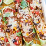 Mexican zucchini boats on a baking tray.