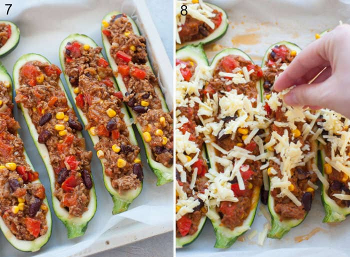 Zucchini boats filled with meat filling. Cheese is being sprinkled over zucchini boats.