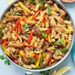 Chicken fajita pasta in a frying pan.