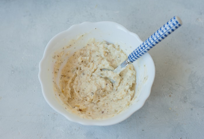 Mayo parmesan marinade in a white a white bowl.