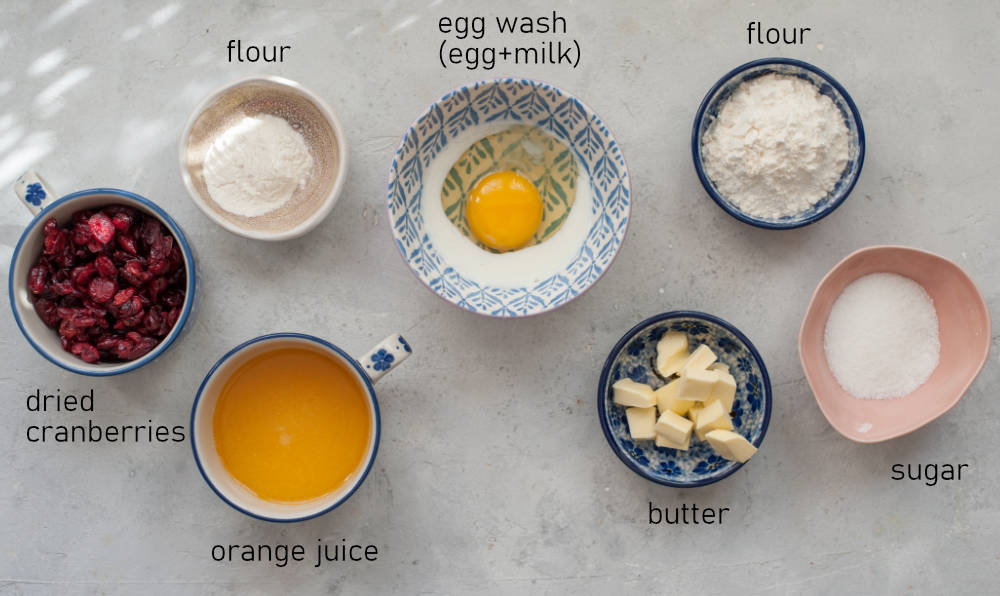 Labeled ingredients for crumble, egg wash and cranberries for the brioche dough.