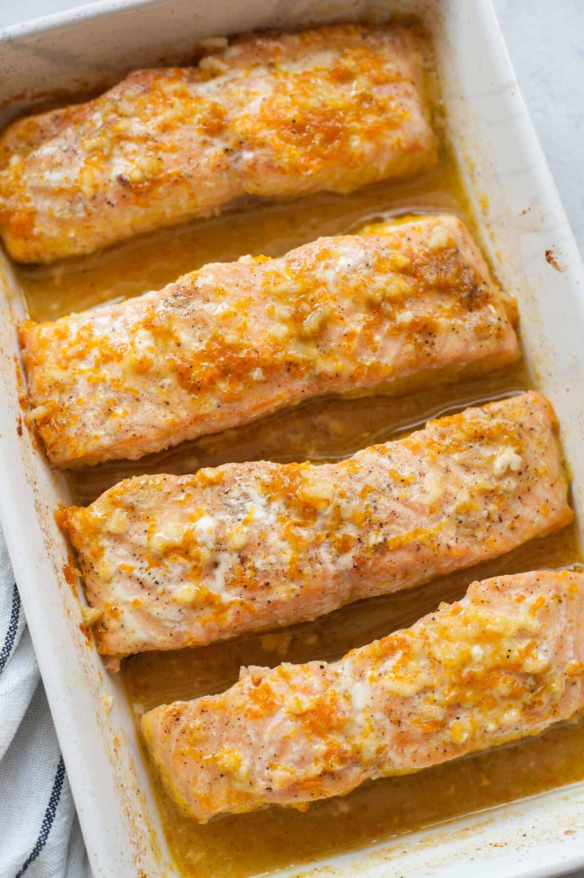 Orange maple salmon in a baking dish.