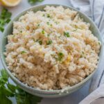 Parmesan cauliflower rice in a green bowl.