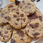 Rye chocolate chip cookies on a white plate.