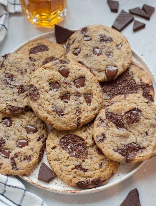 Rye chocolate chip cookies on a white plate.