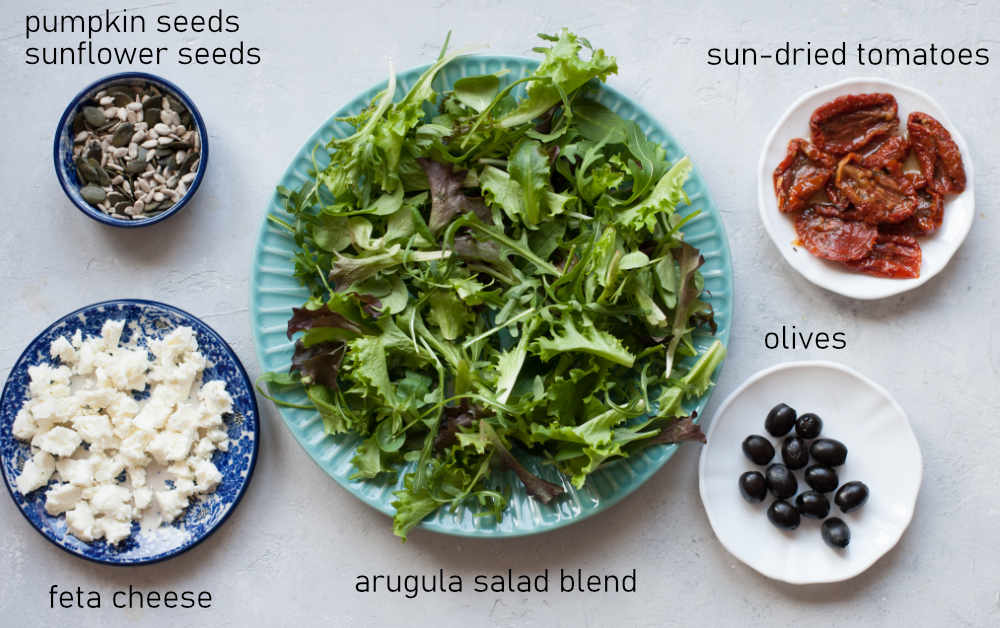 Labeled ingredients for sun-dried tomato salad.