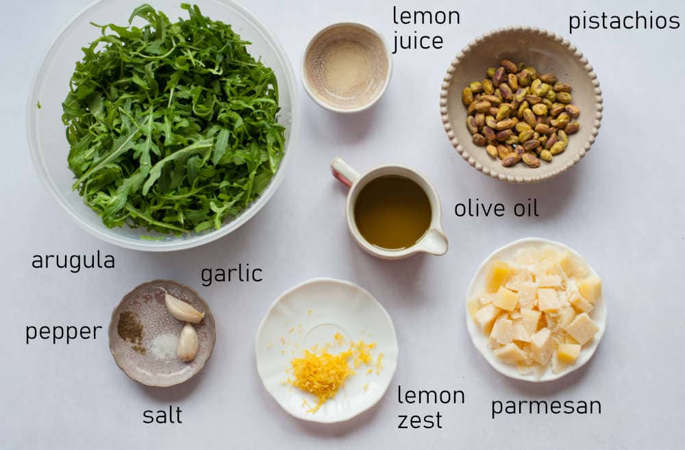 Labeled ingredients for arugula pistachio pesto.