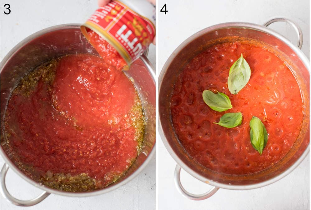 Crushed tomatoes are being added to the pot. Basil leaves in a pot with marinara sauce.