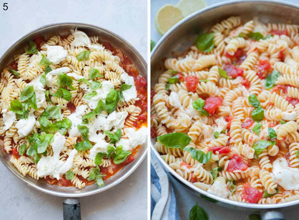 Pasta with tomato sauce, torn mozzarella and basil leaves in a frying pan.