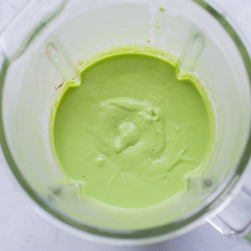 Pea mint puree in a blender bowl.