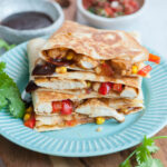 Bbq chicken quesadillas on a blue plate.