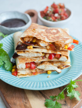 Bbq chicken quesadillas on a blue plate.