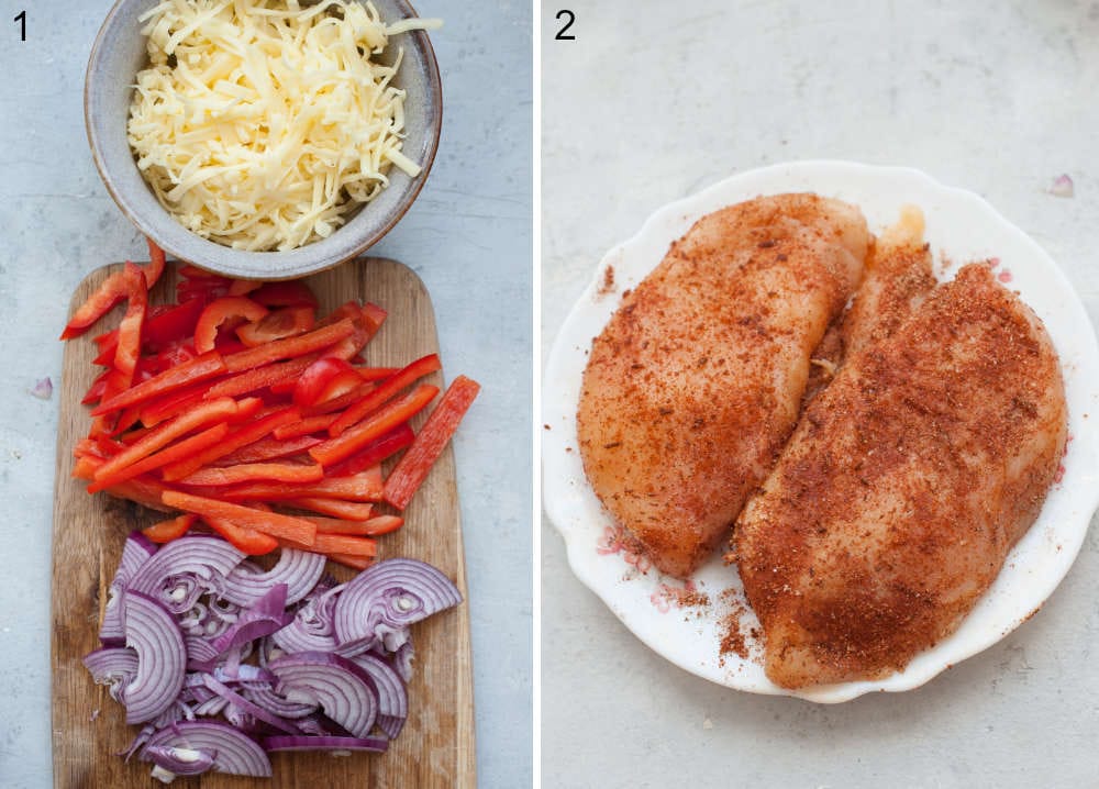 Grated cheese in a bowl. Chopped red pepper and red onion on a wooden board. Chicken with spices on a plate.