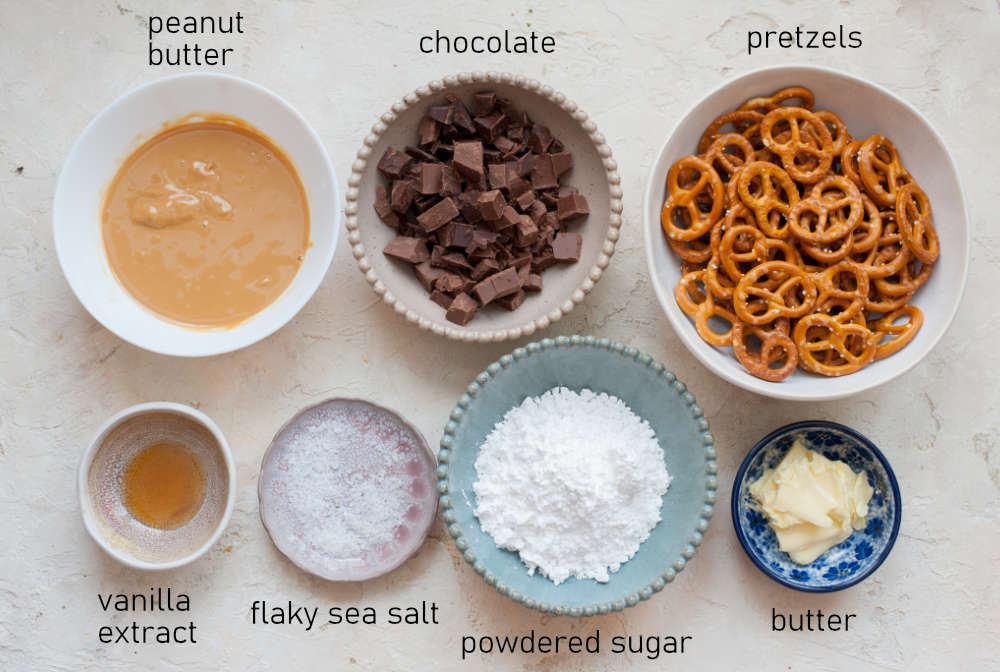 Labeled ingredients needed to prepare chocolate peanut butter pretzels.