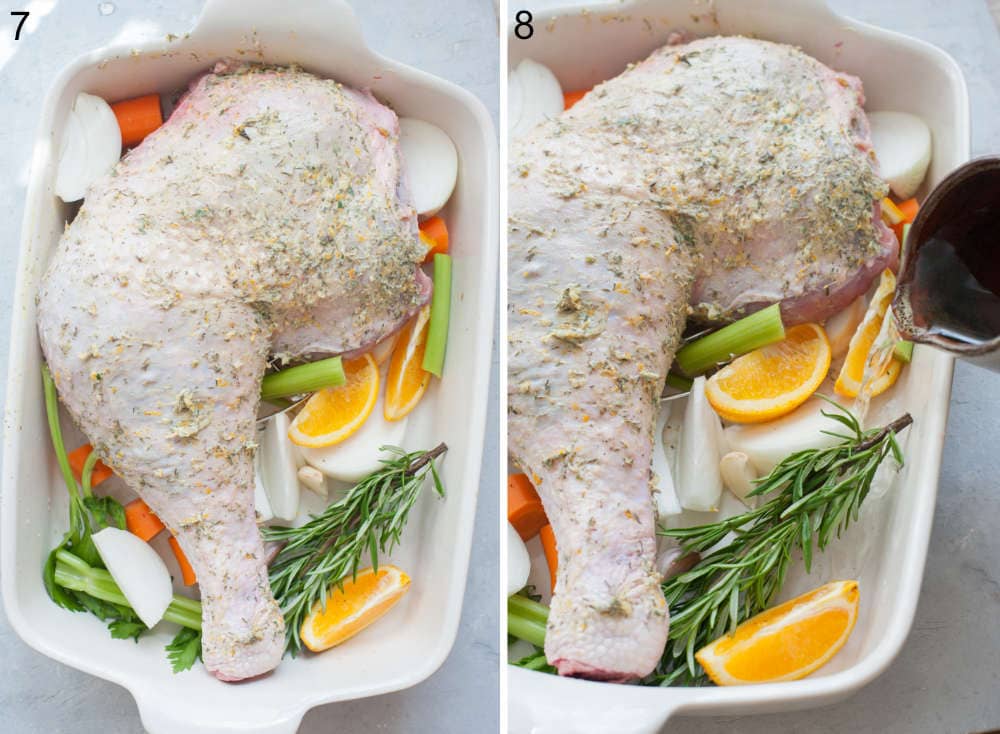 Wine is being poured into a casserole dish with turkey leg and vegetables.