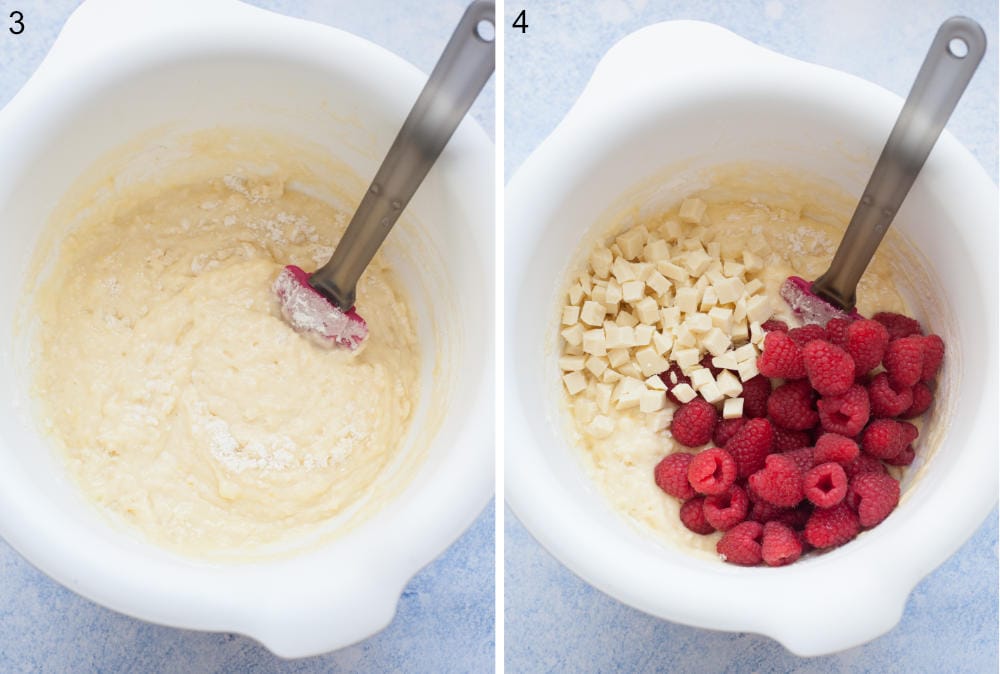 Muffin batter in a white bowl. Muffin batter with white chocolate chunks and raspberries in a bowl.