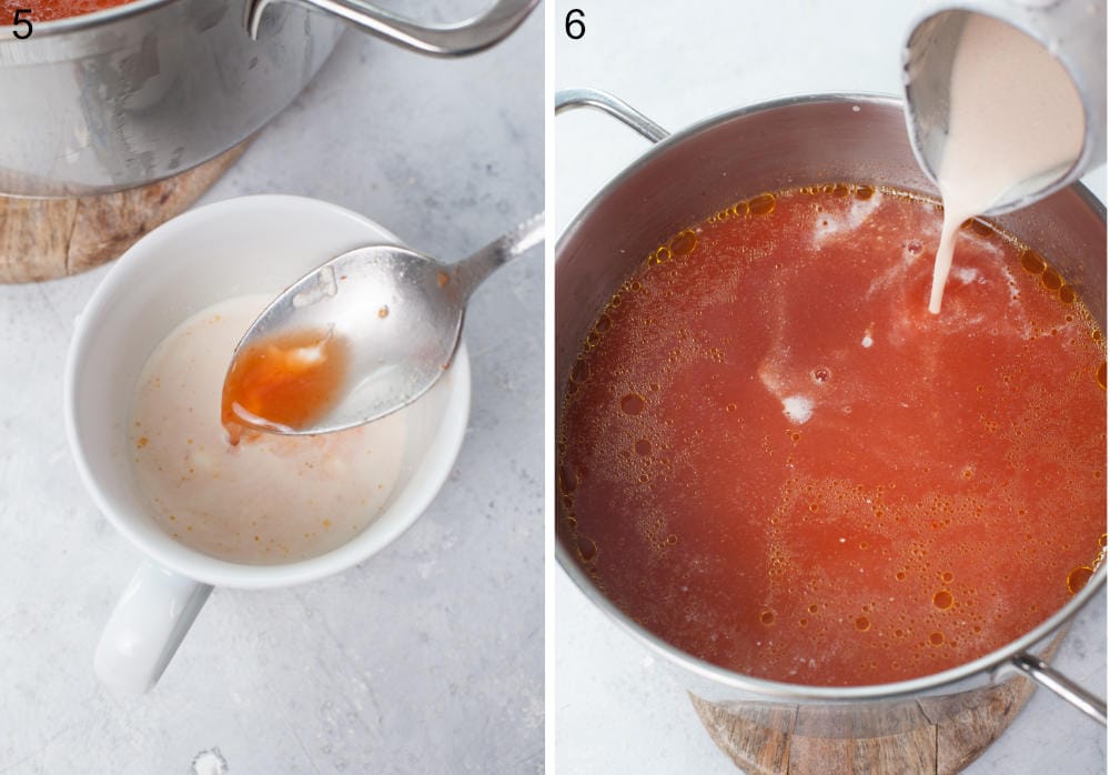 Cream is being tempered in a cup. Tempered cream is being added to a pot with tomato soup.