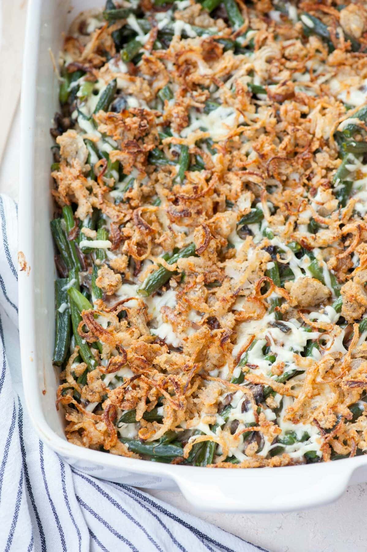 Green bean casserole from scratch in a white casserole dish.