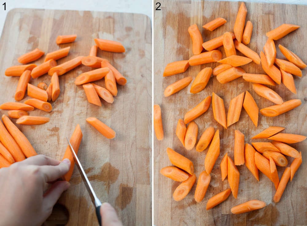Carrots are being cut into chunks on a wooden chopping board.