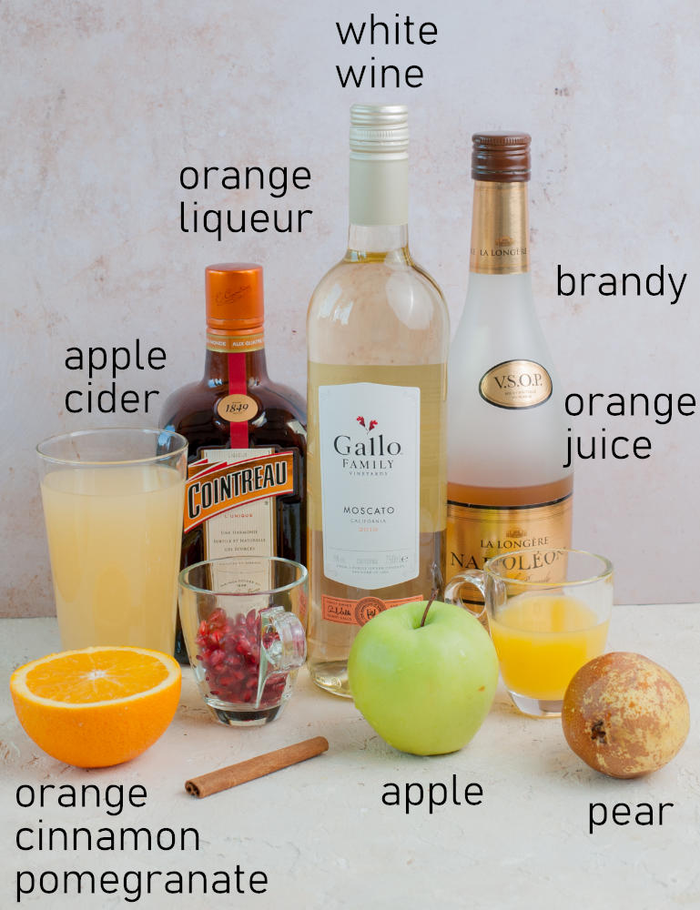 Labeled ingredients needed to prepare apple cider sangria.