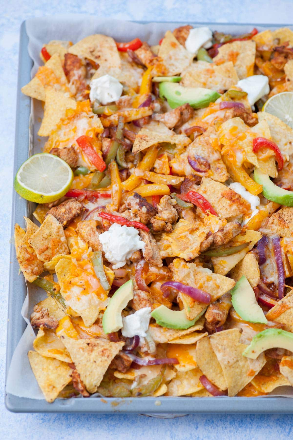 Chicken Fajita Nachos on a baking sheet.