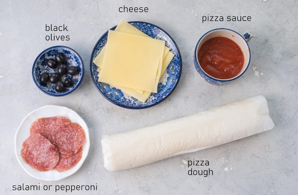 Labeled ingredients for pizza mummies.