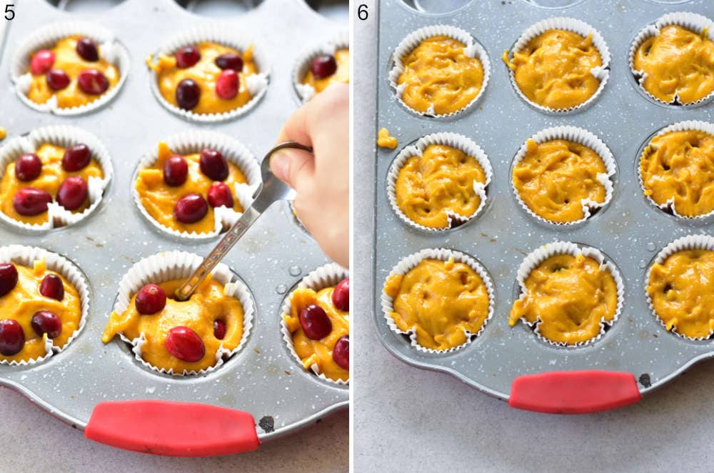 Cranberries are being submerged into pumpkin muffin batter.