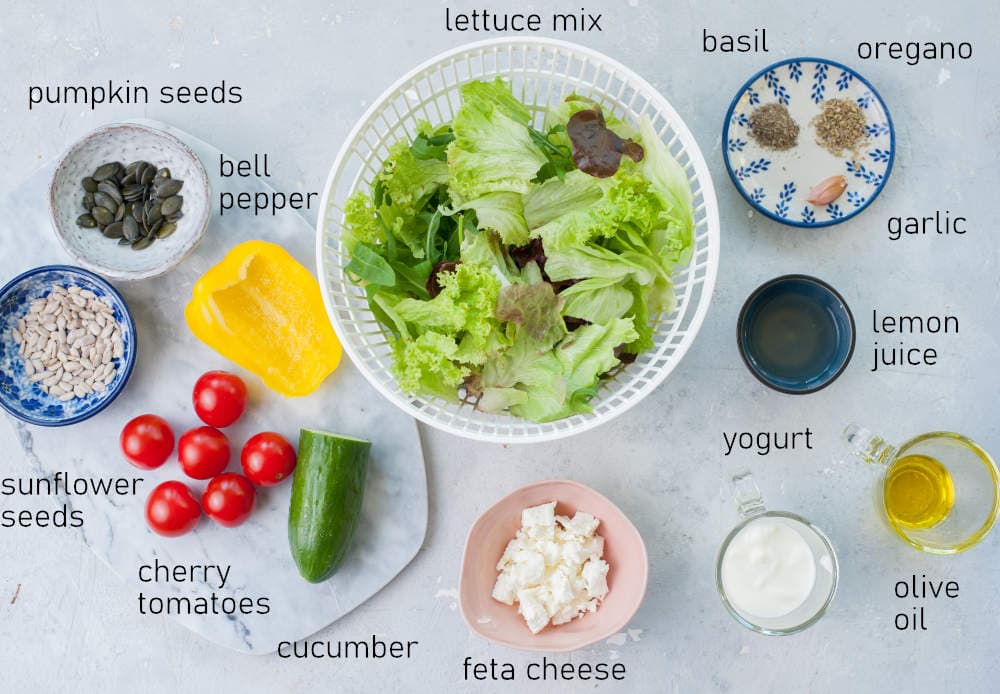 Labeled ingredients for salad with yogurt dressing.