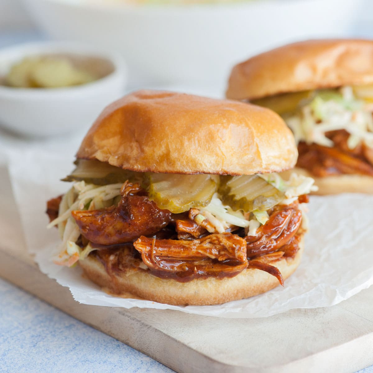 BBQ Chicken burger on a wooden board.