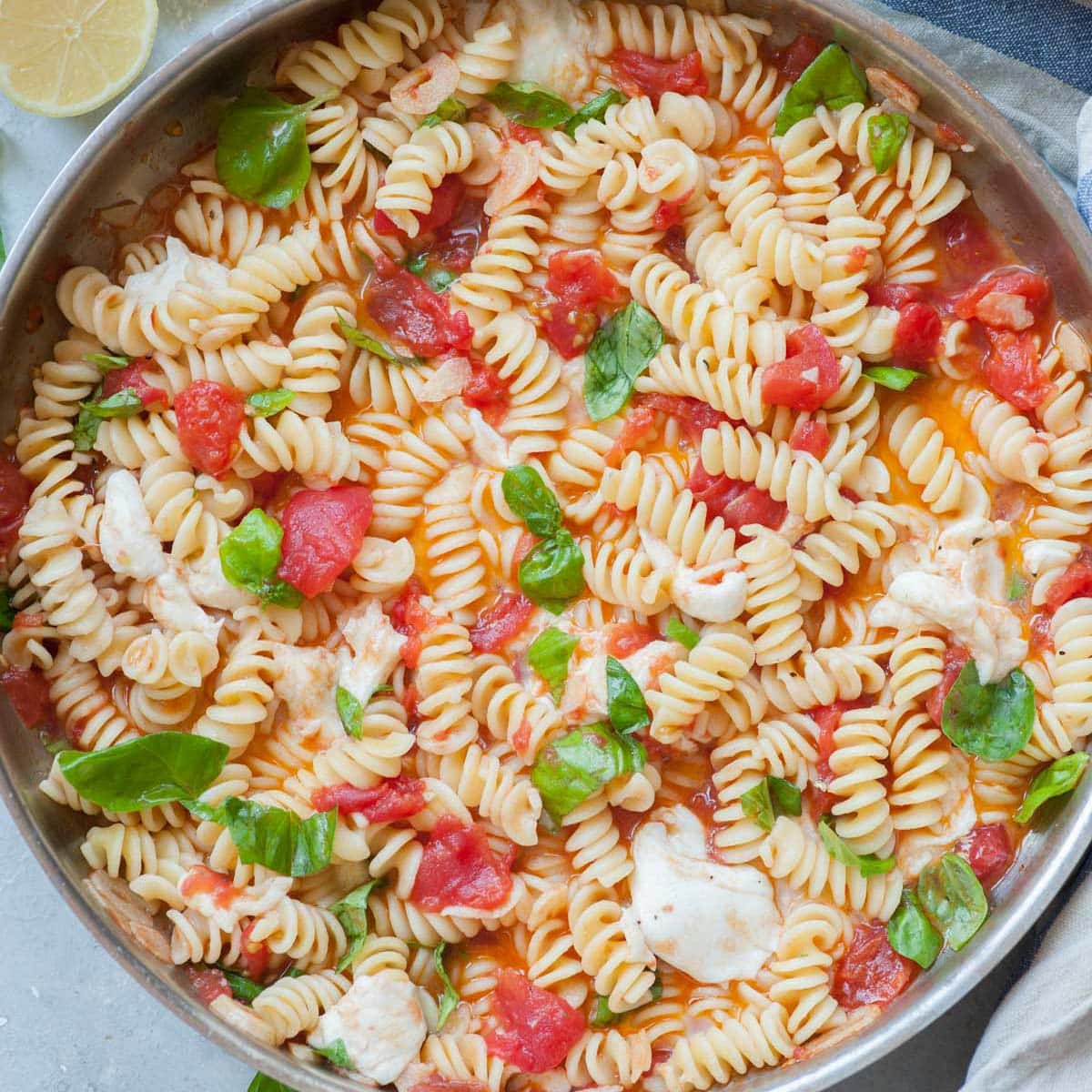 Caprese pasta in a frying pan.