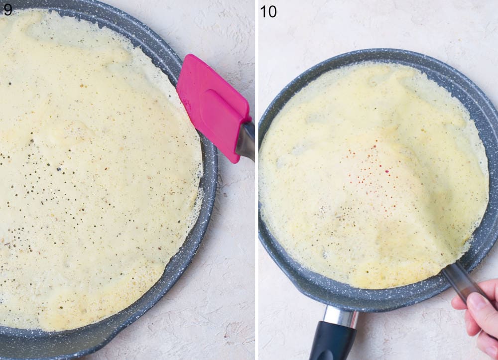 A crepe in a pan is being flipped over with a spatula.