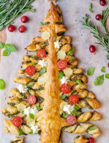 Puff pastry Christmas tree on a piece of parchment paper.