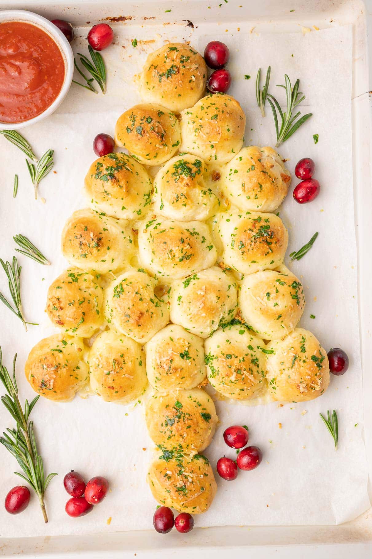 Pull-apart Christmas tree on a baking sheet lined with parchment paper.