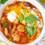 Chicken fajita soup in a white bowl.