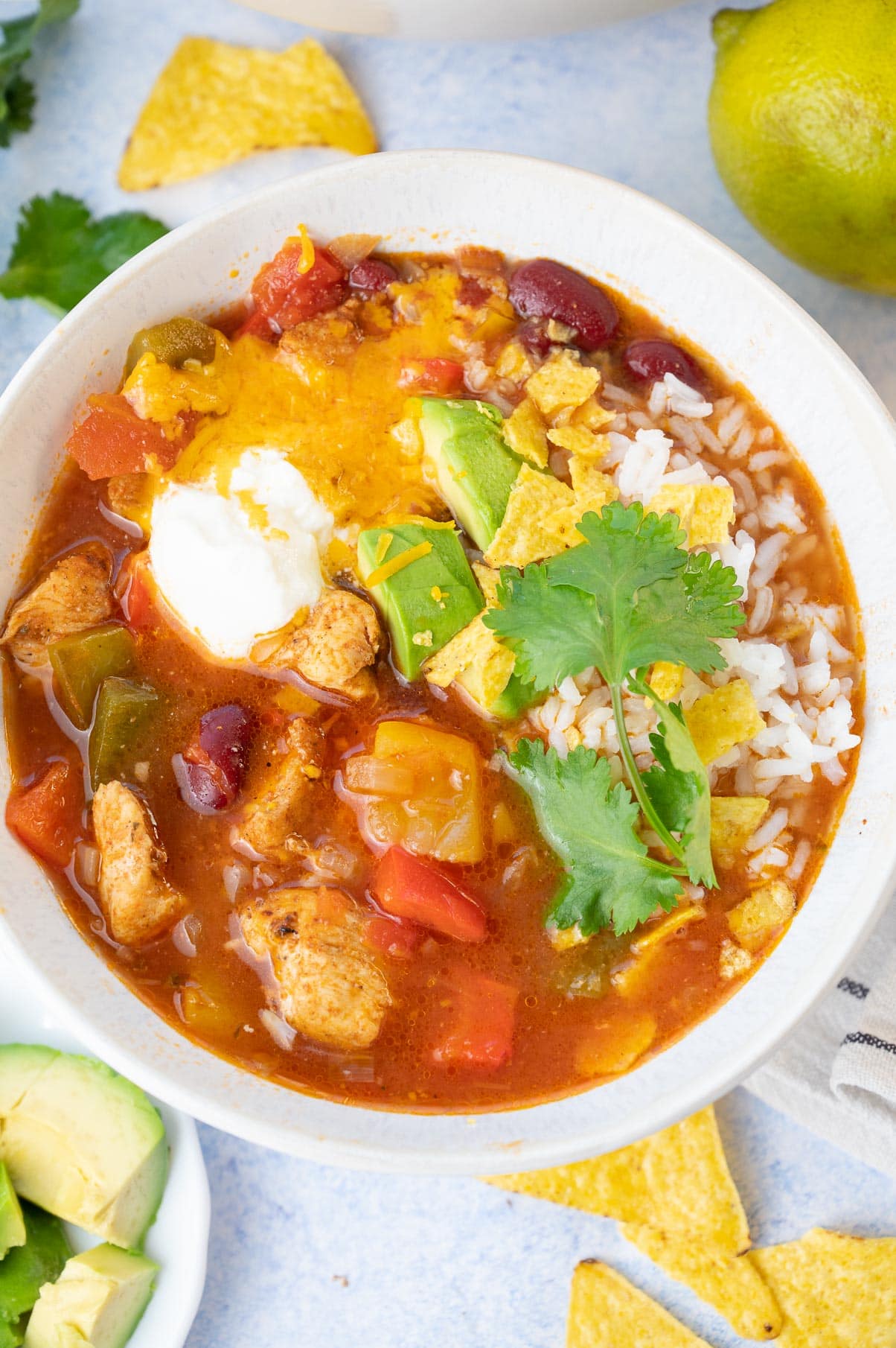 Chicken fajita soup in a white bowl.