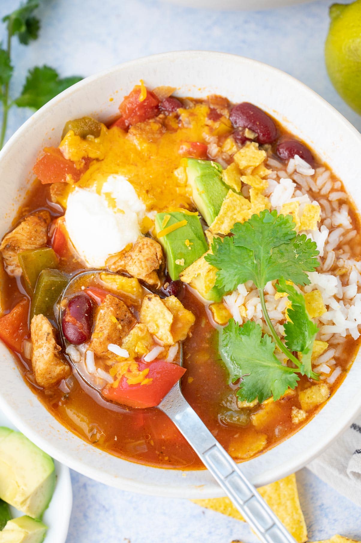 Chicken fajita soup in a white bowl.