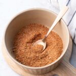 Fajita seasoning in a brown bowl.