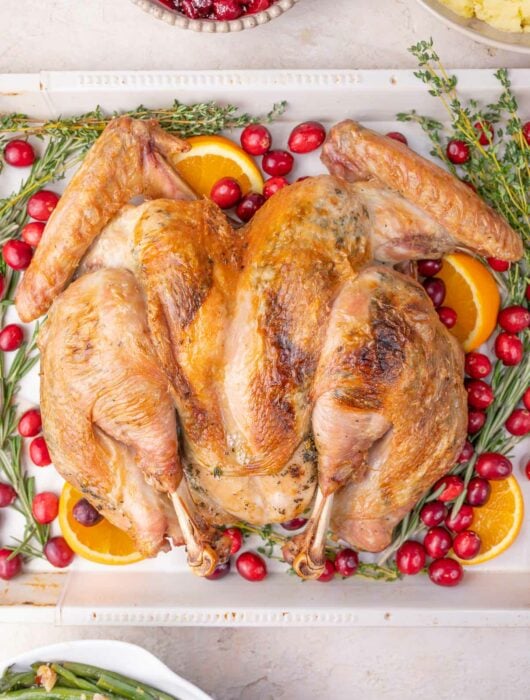 Spatchcock turkey on a baking sheet.