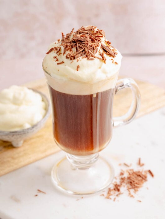 Bourbon coffee with whipped cream in a coffee mug.