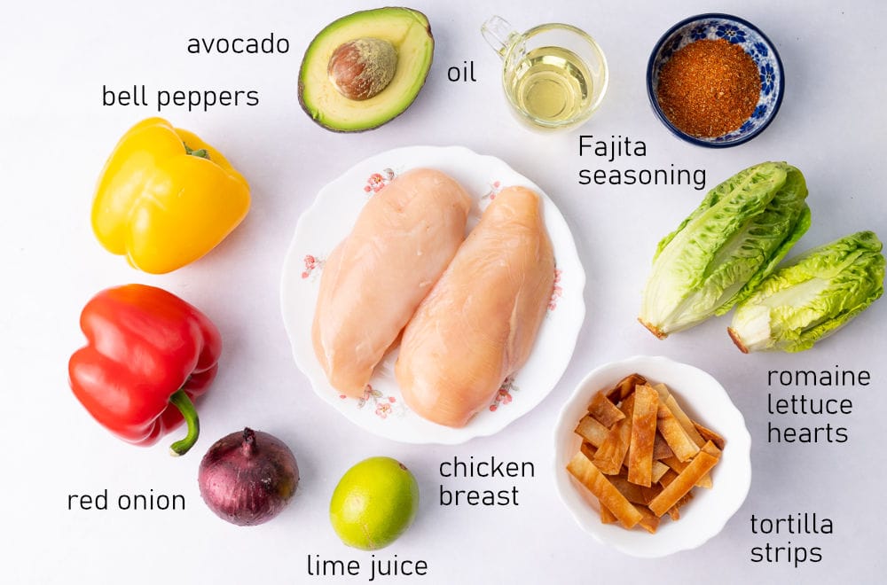 Labeled ingredients for chicken fajita salad.