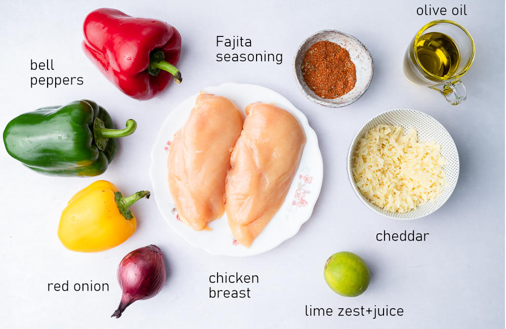 Labeled ingredients for sheet pan chicken fajitas.