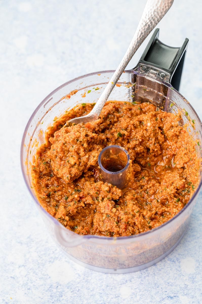 Sun-dried tomato pesto in a food processor bowl.